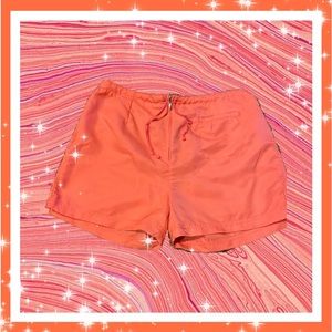 coral NIKE track shorts